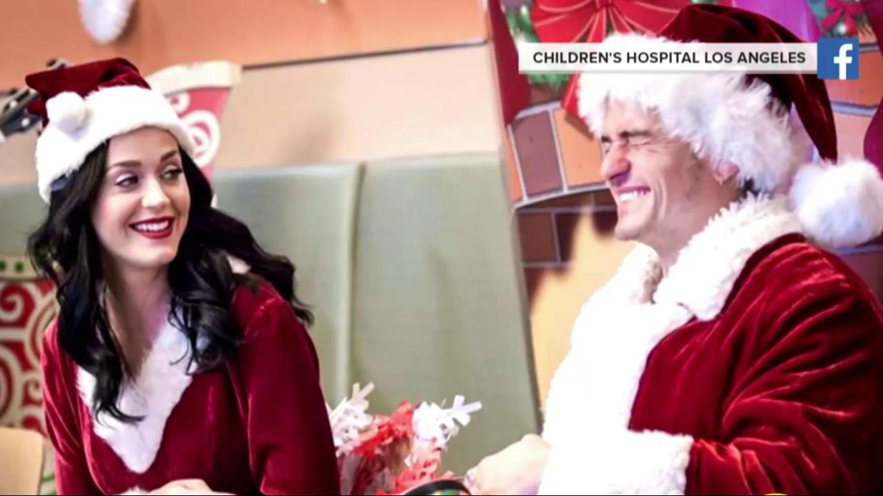 Katy Perry and Orlando Bloom play Santa & Mrs. Claus at LA children's hospital