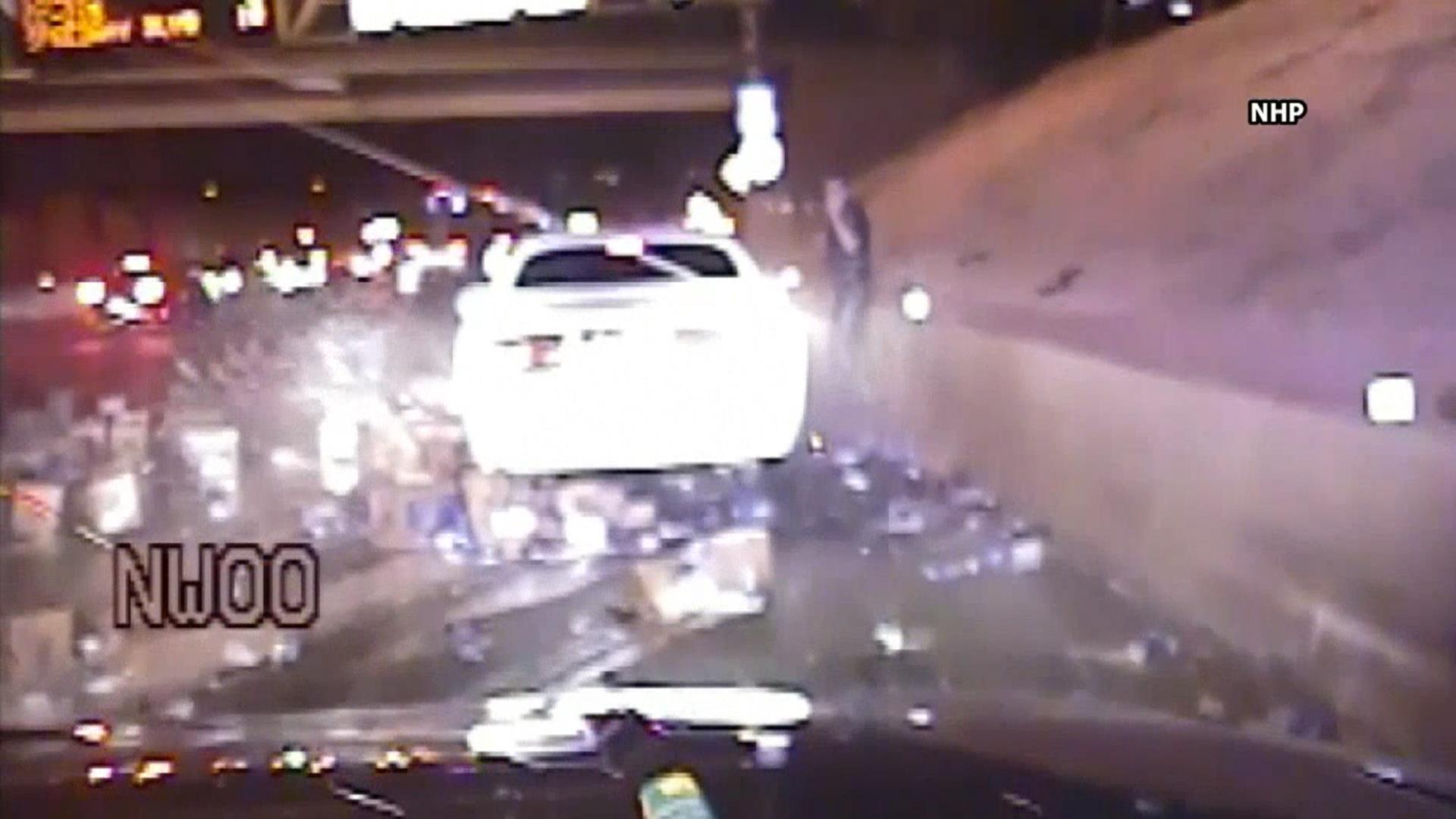 Watch beer truck crash interrupt officer's traffic stop