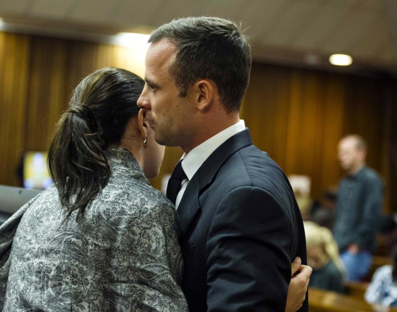 Image: Oscar Pistorius hugs his sister Aimee on the fifth day of his trial
