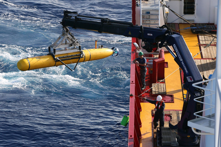 Image: The Bluefin-21 Autonomous Underwater Vehicle is craned over the side of the Australian Defence Vessel Ocean Shield in the southern Indian Ocean during the continuing search for the missing Malaysian Airlines flight MH370