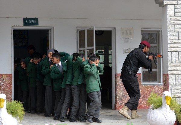 IMAGE: A Pakistani Elite Police Force member takes part in a drill to fight against militants at a schoolhool