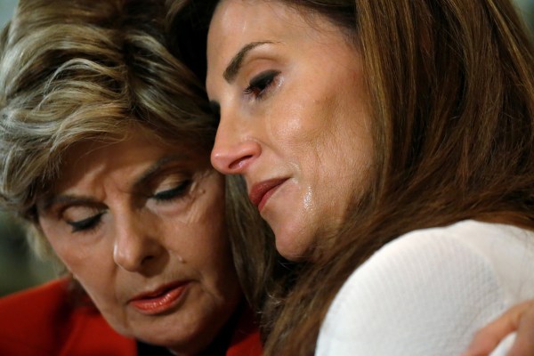 Image: Lawyer Gloria Allred hugs crying Karena Virginia, who claimed to be the victim of sexual assault by Republican presidential candidate Trump back in 1998, during a news conference in the Manhattan borough of New York