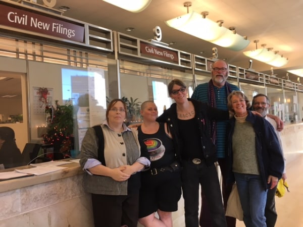 Photo of nonbinary petitioners in San Francisco Superior Court