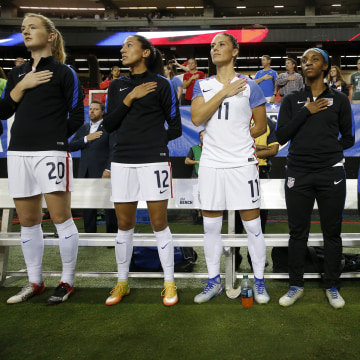 Image: Megan Rapinoe kneels during national anthem
