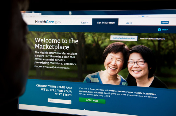 (FILES)A woman looks at the HealthCare.gov insurance exchange internet site in this October 1, 2013 file photo in Washington, DC.  With America's budg...