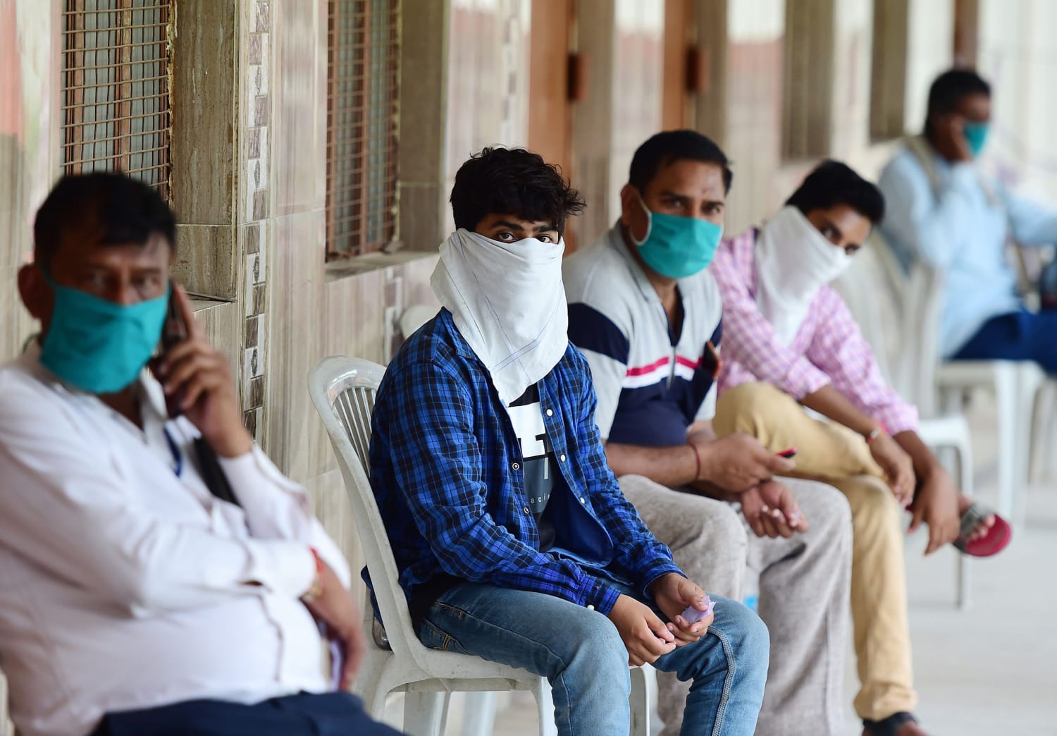 Coronavirus: India hits 2 million cases as health volunteers go on strike