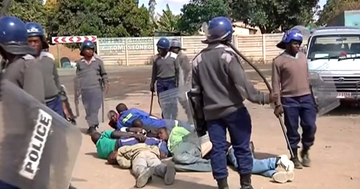 Riot Police Lash Out At Striking Taxi Drivers 