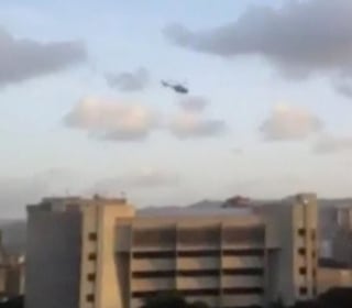 Helicopter Swoops Over Venezuela Supreme Court Amid Explosions, Gunfire