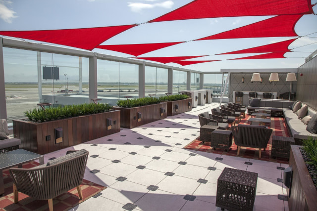 Image: Delta Air Lines lounge with outdoor deck in Terminal 4 at New York's JFK airport.