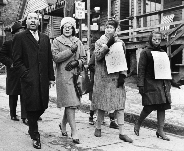Image: King and his wife, Coretta, second from left, join pickets during a tour of an Atlanta area slum