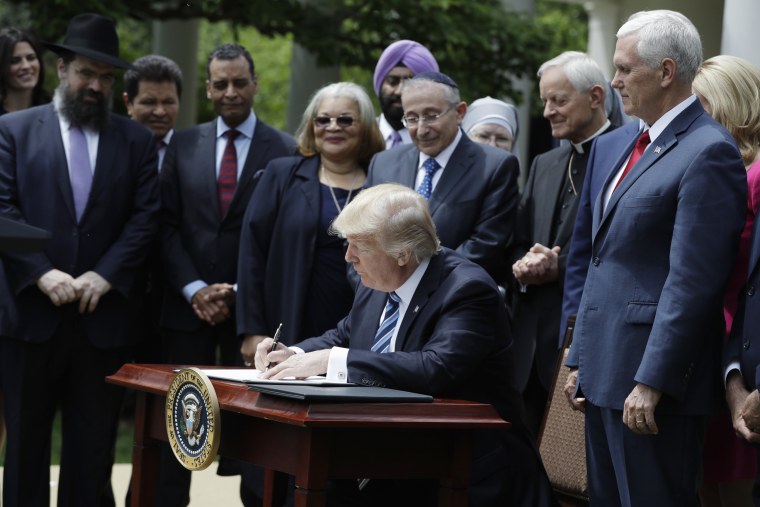 Image: Donald Trump signs an executive order