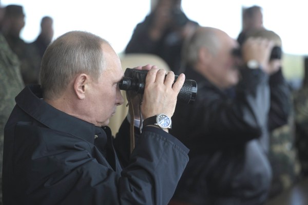 Image: Russian President Vladimir Putin watches the closing stage of Zapad 2013