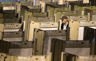 Image: A technician gets voting machines ready for the presidential election, in Philadelphia