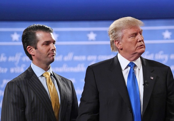 Image: Donald Trump (R) standing with his son Donald Trump Jr.