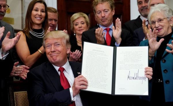 Image: Trump signs an Executive Order on healthcare at the White House in Washington