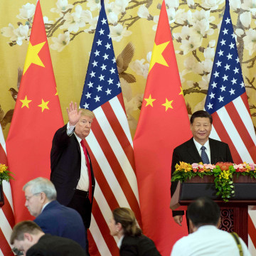Image: President Donald Trump waves next to Chinese President Xi Jinping after delivering a joint statement