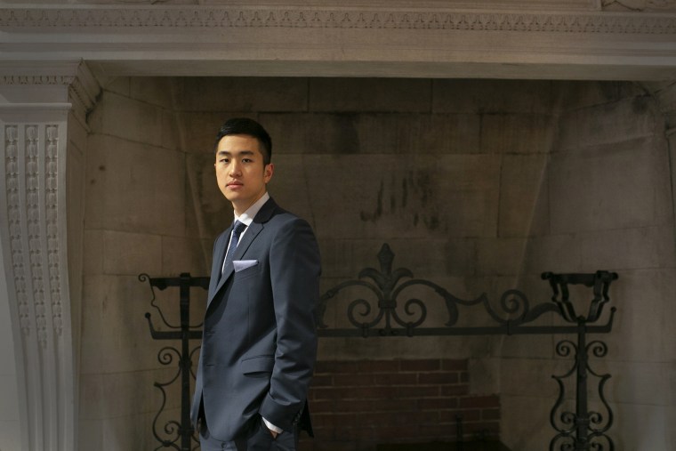 Jin Kyu Park, awarded a Rhodes Scholarship, stands in the Barker Center at Harvard University.