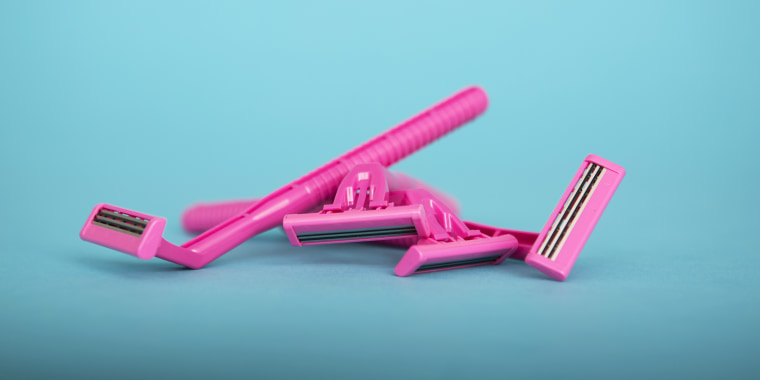 Pink generic razors on a blue background