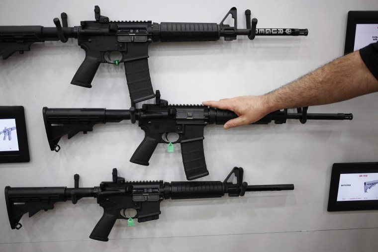 Image: AR-15 rifles are displayed on the exhibit floor during the National Rifle Association (NRA) annual meeting in Louisville, Kentucky