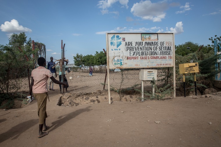 Image: A sign and comment box tells refugees to report sexual exploitation and abuse in the Kakuma refugee camp.