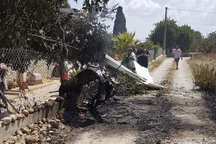Image: The wreckage after a helicopter and small plane collided in Mallorca, Spain, on Aug. 25, 2019. Authorities say at least five people were killed.
