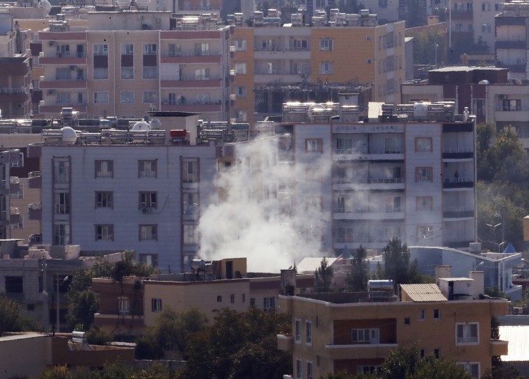 Image: Smoke billows from targets in Ras al-Ayn, Syria, caused by shelling by Turkish forces