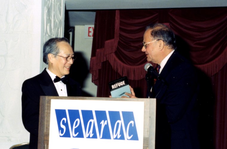 Image: Le Xuan Khoa receives an award at the organization's "Thank You America: Two Decades of Refugee Resettlement" gala in 1998.