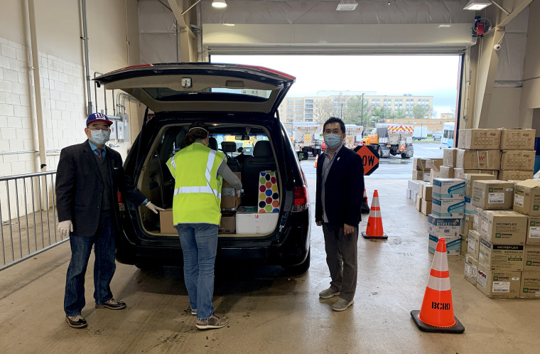 James Chuang, an adviser of Taiwan's Overseas Community Affairs Council in New York, and others load up a van to deliver supplies to Queens' hospitals.