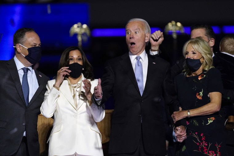 Biden and Harris celebrate after speeches to the nation