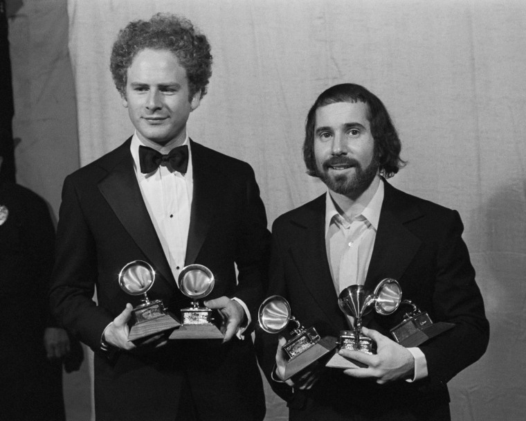 Simon And Garfunkel Holding Grammy Award
