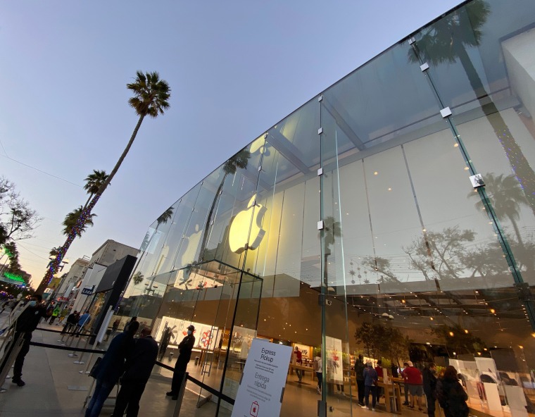 Image: Holiday lights and decorations are seen at the Apple Store on Third Street Promenade on Dec. 18, 2020 in Santa Monica, Calif.