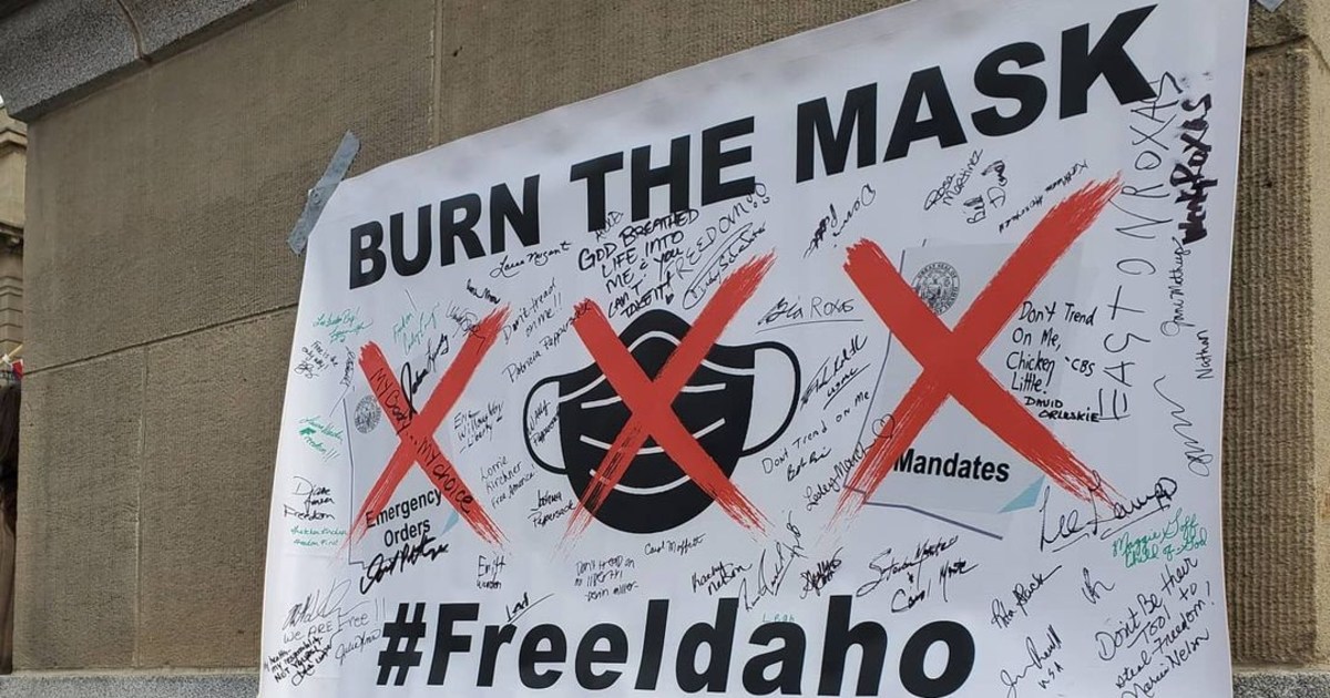 Protesters in Idaho burn masks during Capitol rally